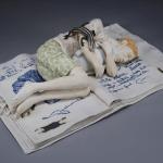 "Research", hand built and slip cast porcelain with lithographic print and underglaze, 6”x17”x10.5”, 2011.